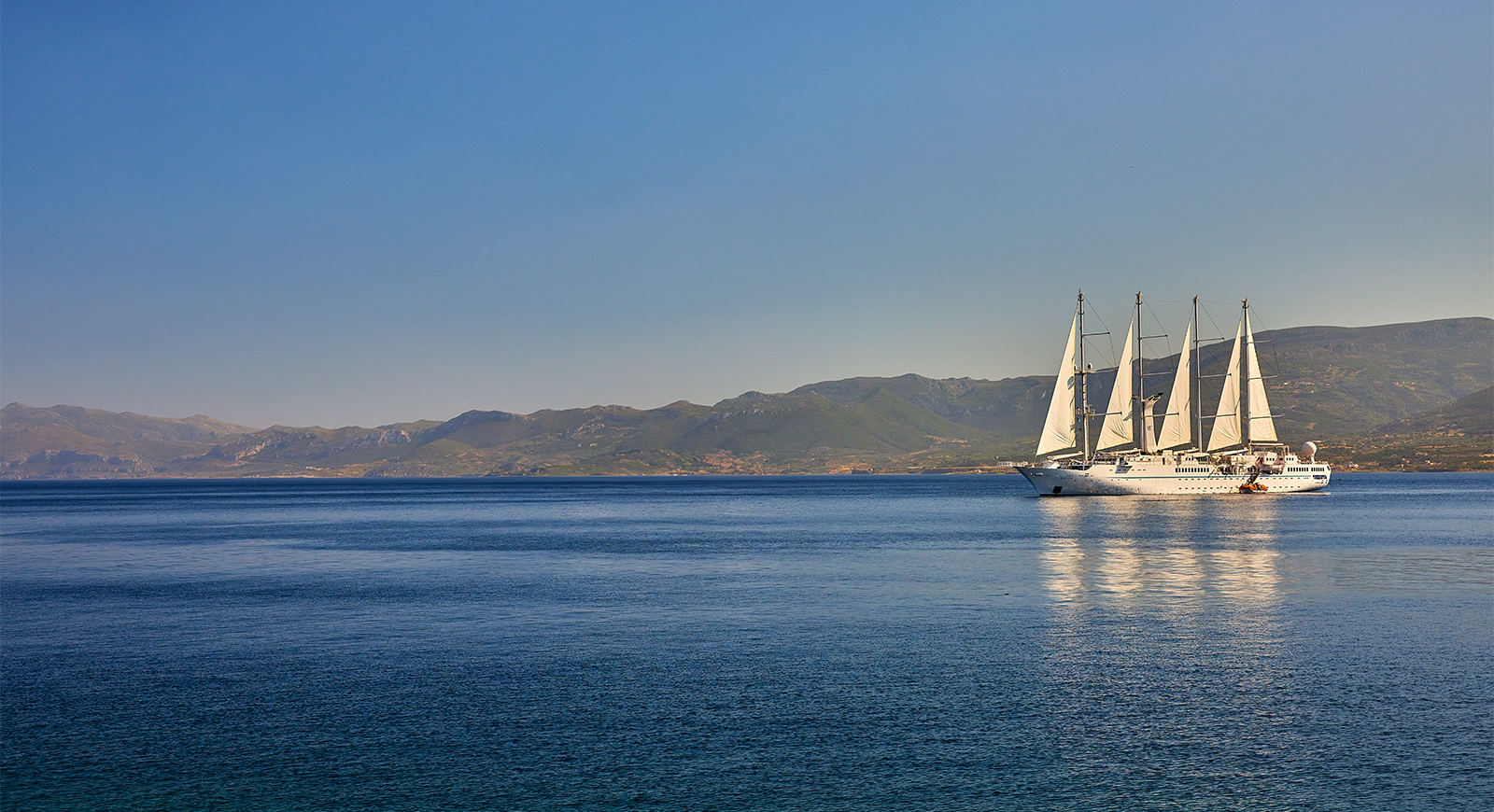 Windstar Cruise ship sailing across the waters.