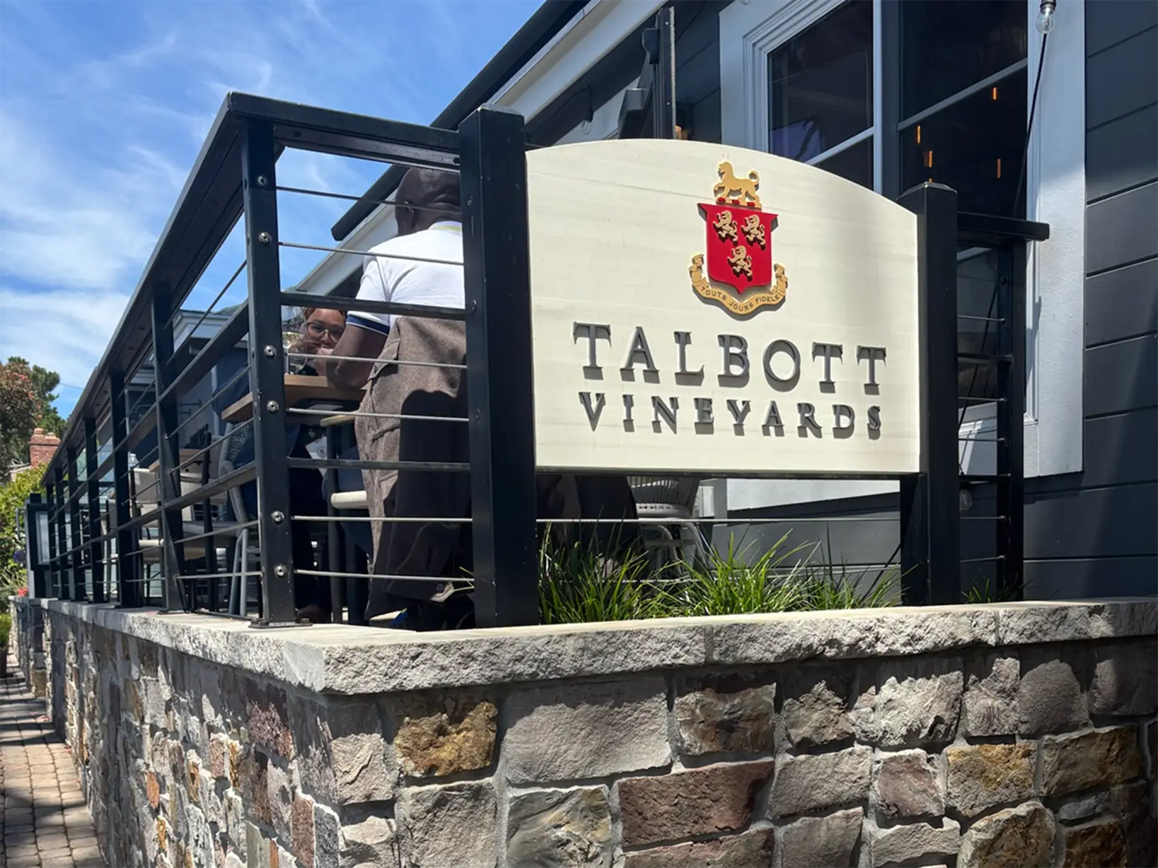 People sitting on the patio at Talbott Vineyards.